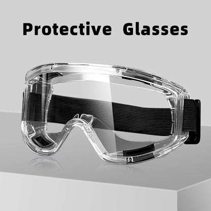 Clear anti-fog safety glasses with adjustable straps, designed for dust, sand, and splash protection for sports and outdoor activities.