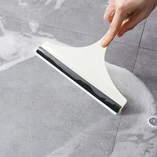 Green silicone water wiper plate for glass cleaning, car windshield scraper and squeegee for windows, bathroom, and kitchen surfaces.