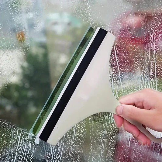 Green silicone water wiper plate for car windshield and glass cleaning, also suitable for bathroom and kitchen surfaces.