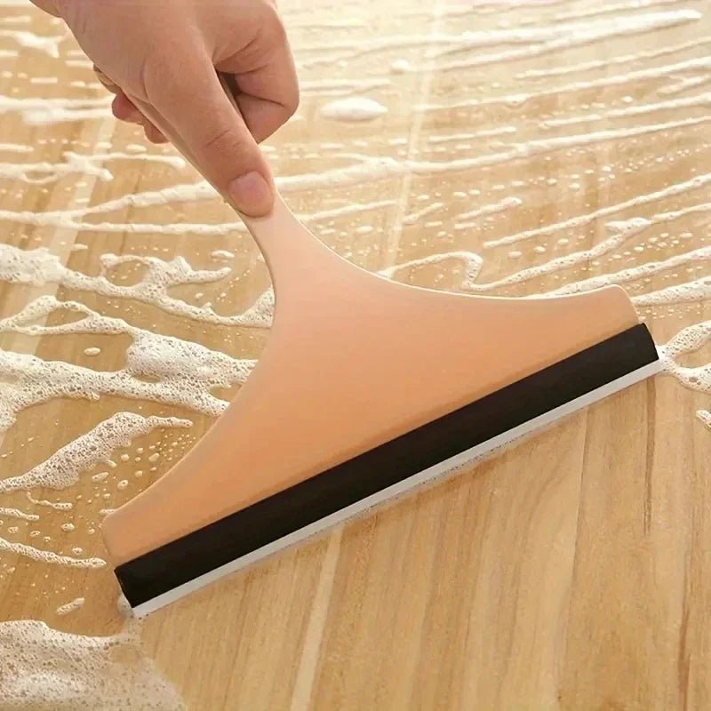 Green silicone water wiper plate for glass cleaning, car windshield scraper, bathroom, and kitchen window cleaner.