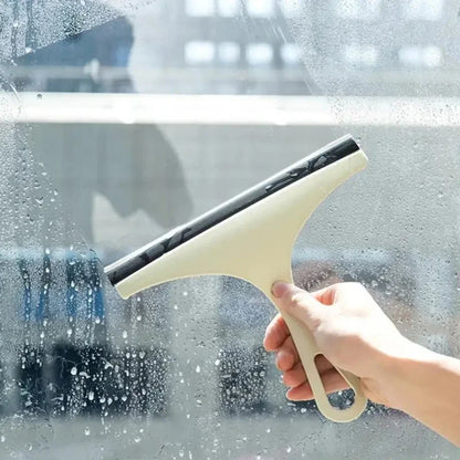 Green silicone water wiper plate and glass cleaner scraper for car windshields, windows, bathroom, and kitchen cleaning.