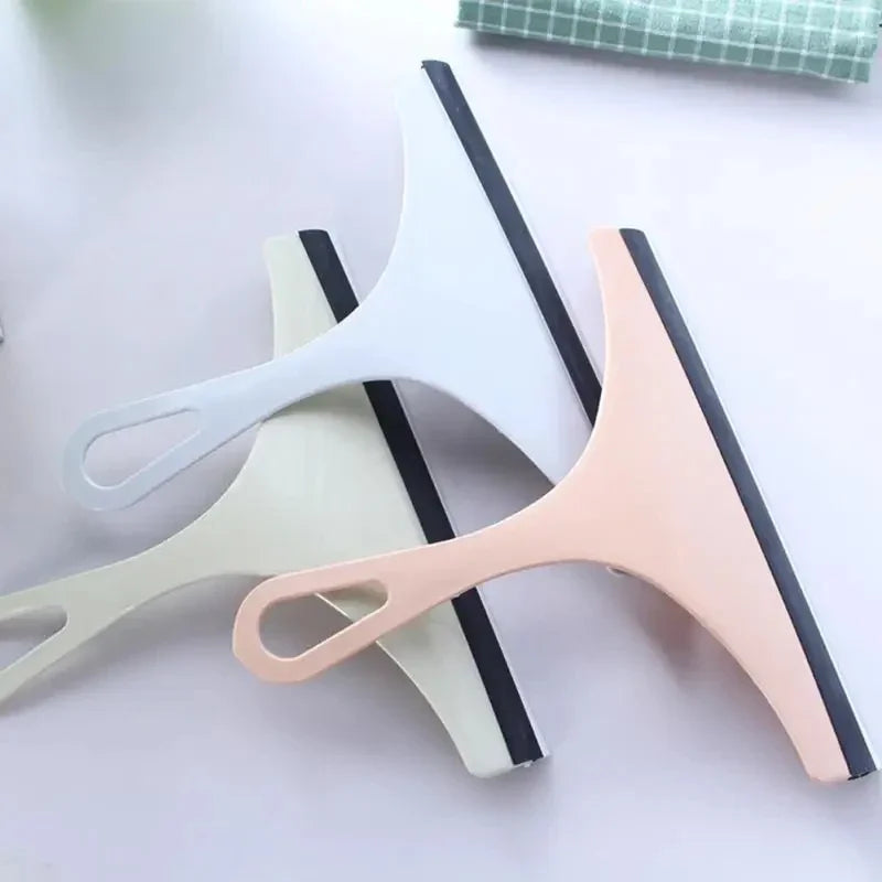 Green silicone water wiper plate for cleaning car windshields, windows, bathroom, and kitchen glass surfaces.