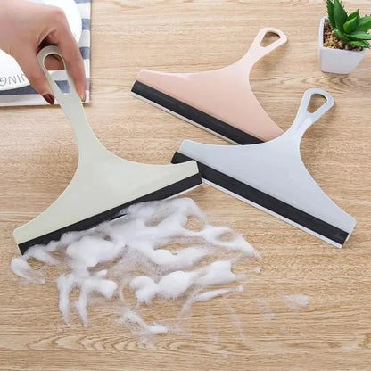 Green silicone water wiper plate glass cleaner and car windshield scraper for automotive, bathroom, and kitchen cleaning.