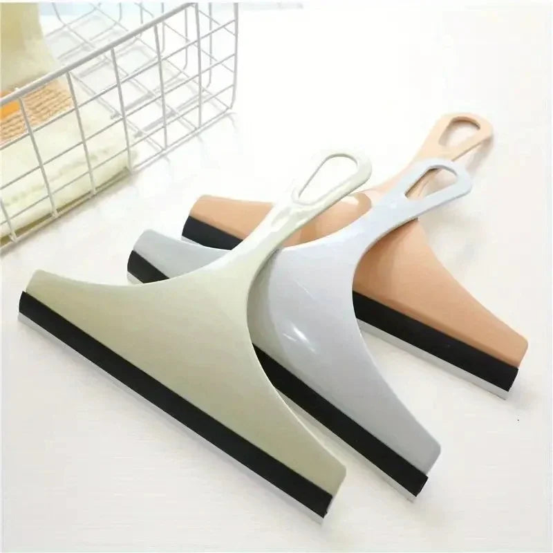 Green silicone water wiper plate and glass cleaner scraper for car windshields, windows, bathroom, and kitchen cleaning.