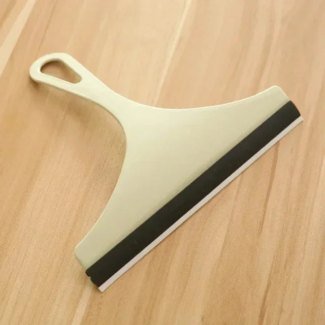 Green silicone water wiper plate for car windshield and glass cleaning, versatile scraper for windows, bathroom, and kitchen surfaces.