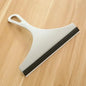 Green silicone water wiper plate and glass cleaner scraper for car windshields, windows, bathroom, and kitchen surfaces.