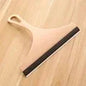 Green silicone water wiper plate cleaner and scraper for car windshield, window, bathroom, and kitchen surfaces.
