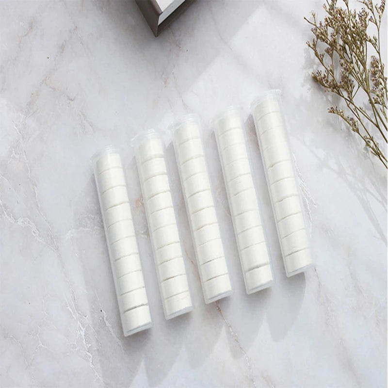 Portable compressed towels from BACKUPMYFILESNOW.COM®, non-woven face towels ideal for camping, hiking, and travel, moistened for convenience.