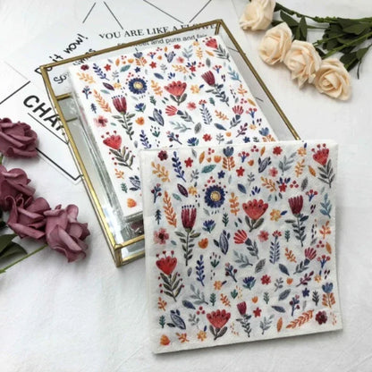 Colorful printed square paper napkins with floral design, suitable for restaurant, hotel, wedding table settings, made of pure wood pulp paper.