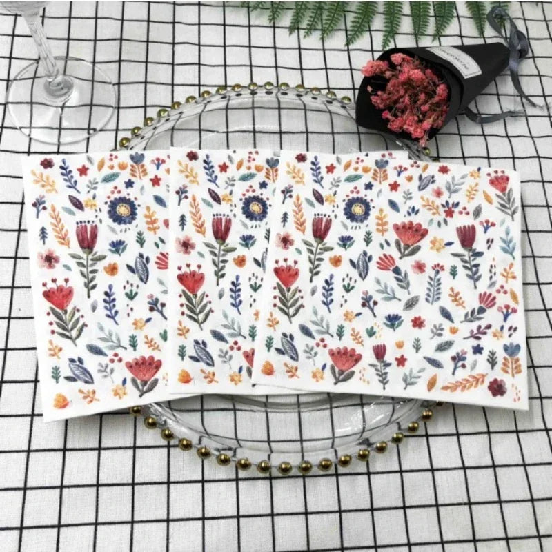 Colorful printed square paper napkins with floral design, ideal for restaurant, hotel, or wedding table settings.