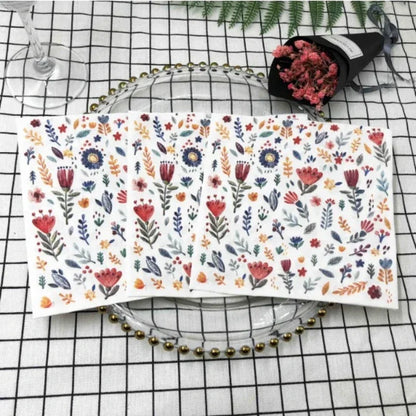 Colorful printed square paper napkins with floral design, ideal for restaurant, hotel, or wedding table settings.