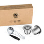 Reusable stainless steel coffee capsule for Nespresso machines, eco-friendly coffee filter with cup, tamper, and spoon included.