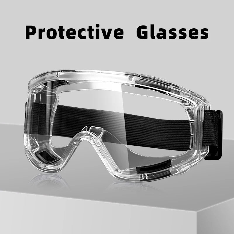 Clear anti-fog safety glasses with adjustable straps, designed for riding, skiing, and sports, protecting against dust, splashes, and sand.