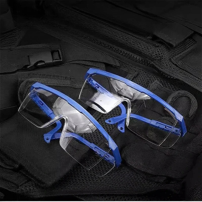 Pair of BACKUPMYFILESNOW.COM chemical goggles with dustproof, windproof, and splash-proof safety protection for laboratory work.