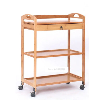 Movable bamboo dining trolley with three layers, small kitchen shelf, and side cabinet for living room or salon use.
