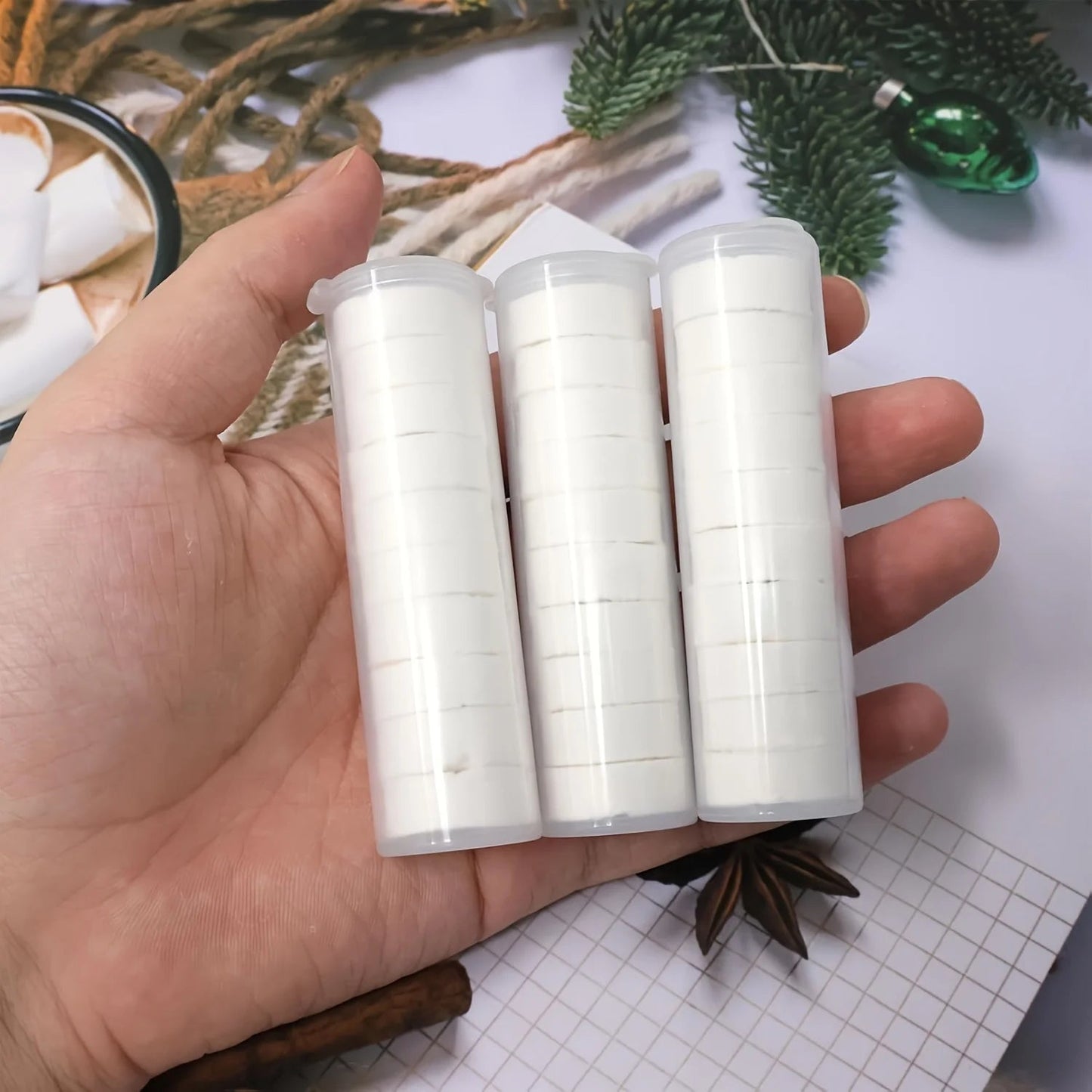 Three tubes of lightweight, heavy-duty compressed towels from BACKUPMYFILESNOW.COM®, ideal for camping, fitness, and travel.