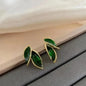 925 silver needle green flower earrings for women, Korean fashion jewelry with zircon leaf design and stud style.