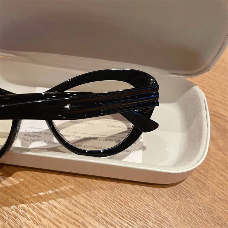 Blue light blocking women's cat eye glasses with small frame and photochromic lenses, trendy design for prescription reading.