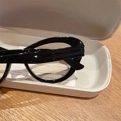 Blue light blocking women's cat eye glasses with small frame and photochromic lenses, trendy design for prescription reading.