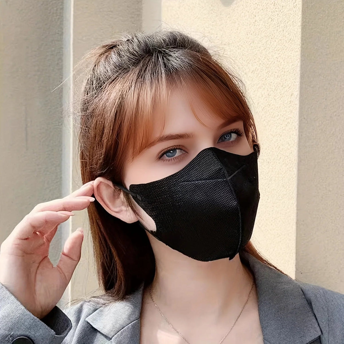 Black 3D disposable protective masks, 100-pack, suitable for outdoor, home, commuting, office, and school use, unisex design.