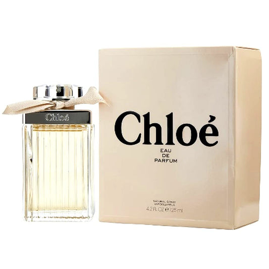 Chloe Eau de Parfum Spray for Women 4.2 oz bottle, elegant glass perfume bottle with a rounded cap, on a neutral background.