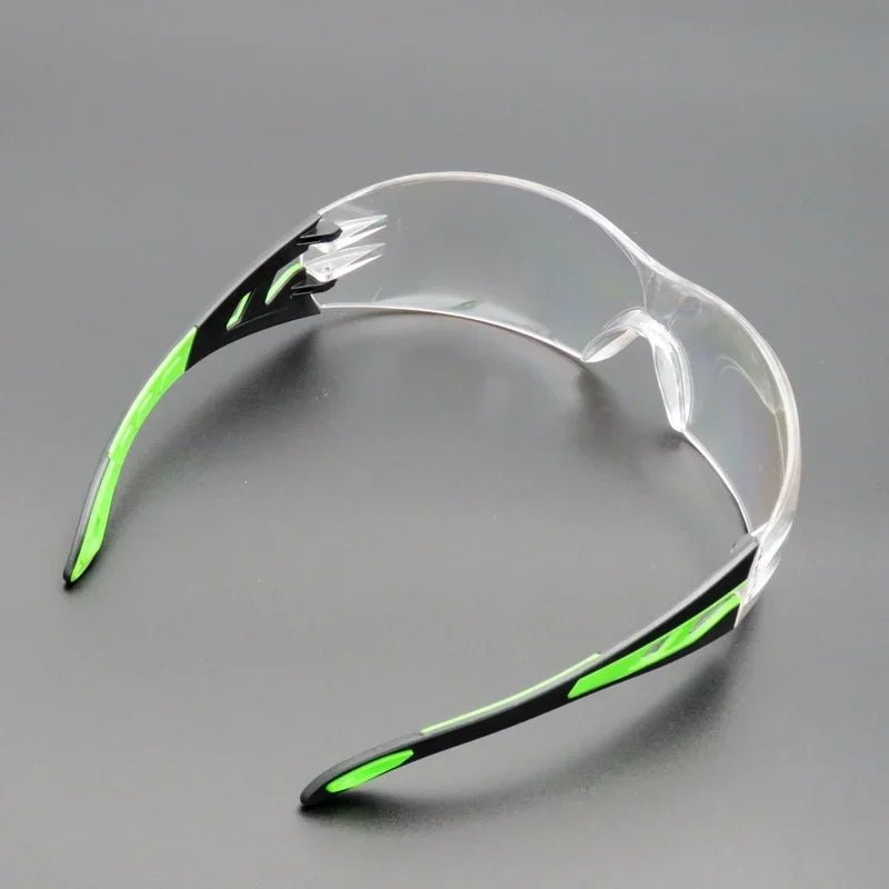 Unisex universal anti-splash safety goggles with clear lenses, designed for industrial, laboratory, cycling, and dustproof eye protection.