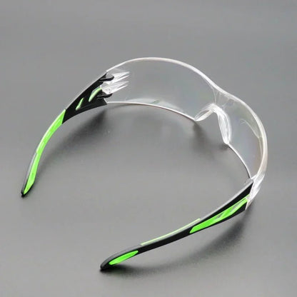 Unisex universal anti-splash safety goggles with clear lenses, designed for industrial, laboratory, cycling, and dustproof eye protection.