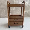 Chocolate solid wood beauty salon trolley cart with double drawers, ideal for barbers or salon professionals.