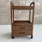Chocolate solid wood beauty salon trolley cart with double drawers, ideal for barbers or salon professionals.