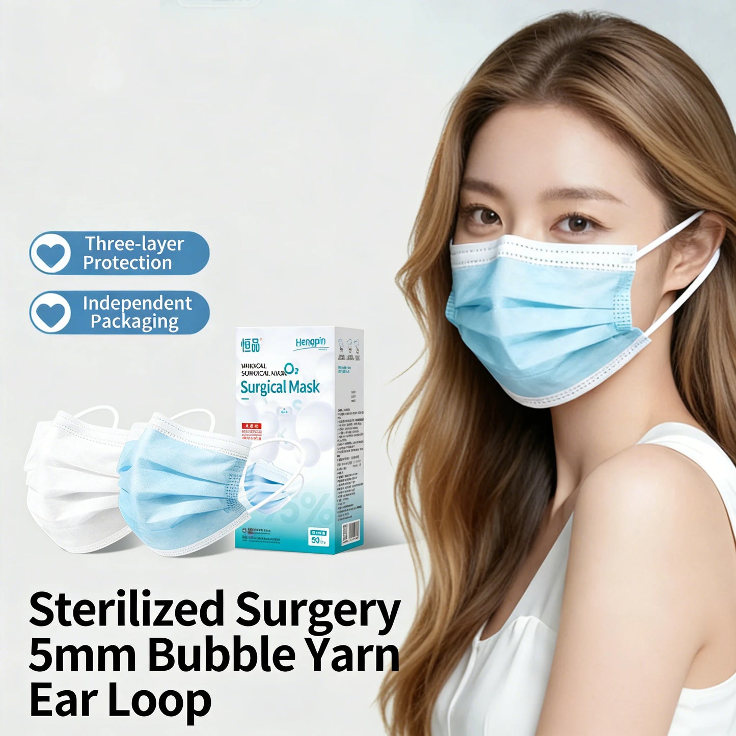 Box of 50 white disposable face masks with 5mm bubble yarn ear loops, 3-layer protective design for adult daily use.