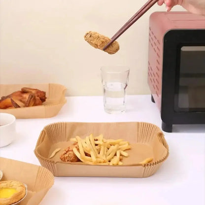 Set of 50 disposable air fryer paper rectangles, oilproof baking mats for microwave, barbecue, and kitchen baking accessories.