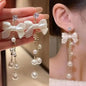 925 silver Korean fashion pearl tassel earrings for women, featuring zircon accents and intricate pearl detailing.