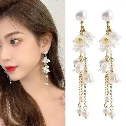 925 silver Korean fashion pearl tassel earrings for women featuring zircon accents and elegant pearl drops, trendy luxury jewelry.