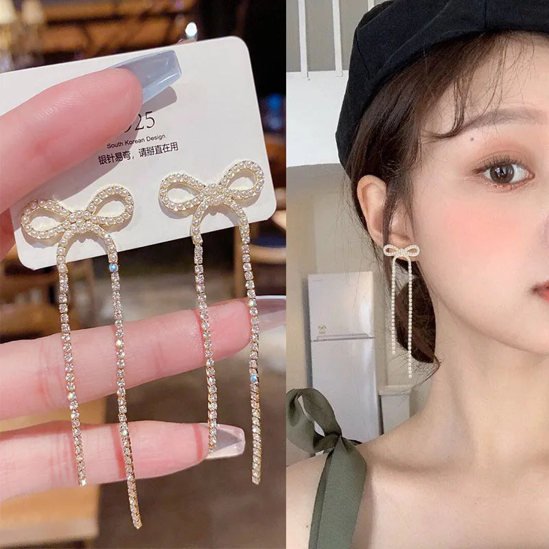 925 silver Korean fashion pearl tassel earrings for women, featuring zircon accents and elegant design.