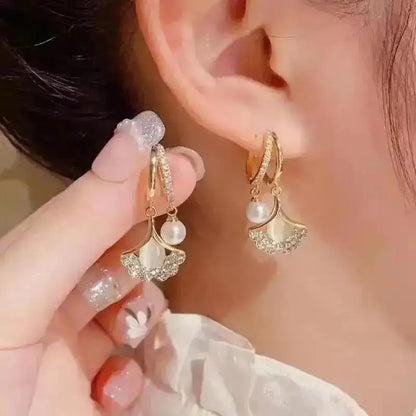 925 silver Korean fashion pearl tassel earrings for women, featuring zircon accents and elegant pearl drops, trendy luxury jewelry.
