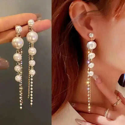 925 silver Korean fashion pearl tassel earrings for women featuring zircon accents and dangling pearl details.