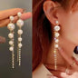 925 silver Korean fashion pearl tassel earrings for women featuring zircon accents and dangling pearl details.
