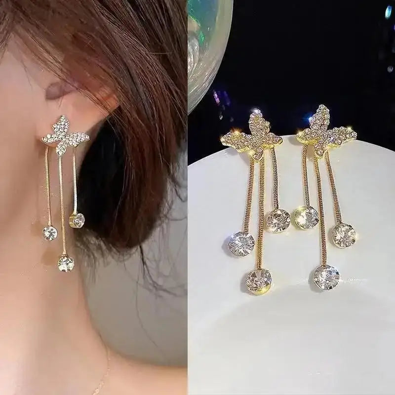 925 silver Korean fashion pearl tassel earrings for women featuring dangling zircon and pearl accents, stylish jewelry accessory.