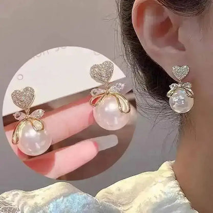 925 silver Korean fashion pearl tassel earrings for women featuring zircon accents and elegant pearl dangles.