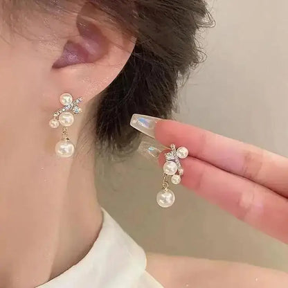 925 silver Korean fashion pearl tassel earrings for women with zircon accents, featuring elegant pearl and crystal details.