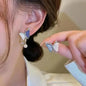 925 silver Korean fashion pearl tassel earrings for women featuring zircon accents and hanging pearl details.