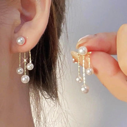 925 silver Korean fashion pearl tassel earrings for women featuring zircon accents and elegant pearl dangles, trending luxury jewelry.