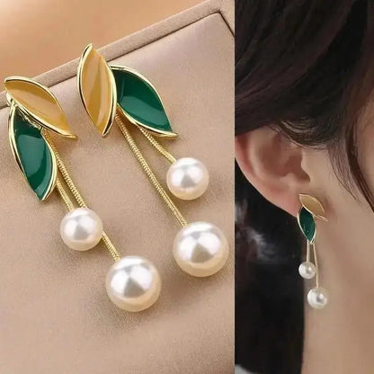 925 silver Korean fashion pearl tassel earrings with zircon accents for women, featuring dangling pearls and intricate design.