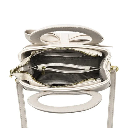 Casual women's handbags featuring cute bow designs in black, white, blue, and khaki PU leather, with shoulder and underarm styles.