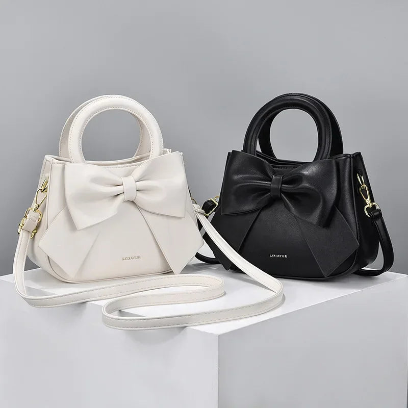 Fashion casual women's handbags featuring cute bows in black, white, blue, and khaki, made of PU leather with shoulder and underarm styles.