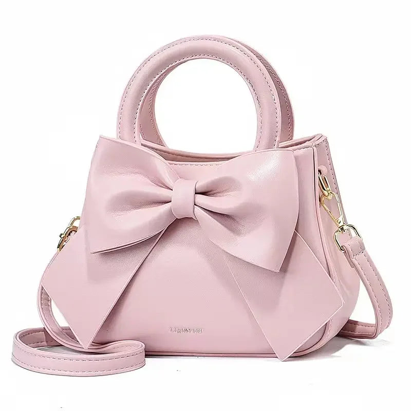 Fashion casual women's handbags with cute bows in black, white, blue, and khaki, featuring PU material and trendy shoulder designs.
