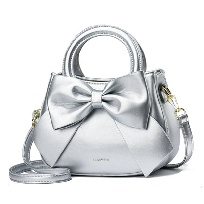Casual women's handbags with cute bows in black, white, blue, and khaki, featuring PU material, shoulder and underarm style.