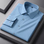 White bamboo fiber men's long sleeve dress shirt from BACKUPMYFILESNOW.COM®, slim fit, anti-wrinkle, suitable for business and formal wear.