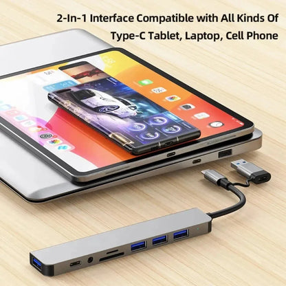 Aluminum 7-in-1 USB C hub with USB 3.0, USB 2.0, and USB C ports, ideal for expanding connectivity on laptops and desktops.