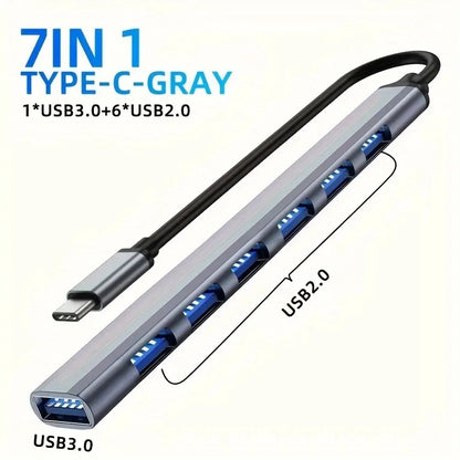 Aluminum 7-in-1 USB C Hub with USB 3.0, USB 2.0, and USB-C ports, designed for versatile device connectivity.